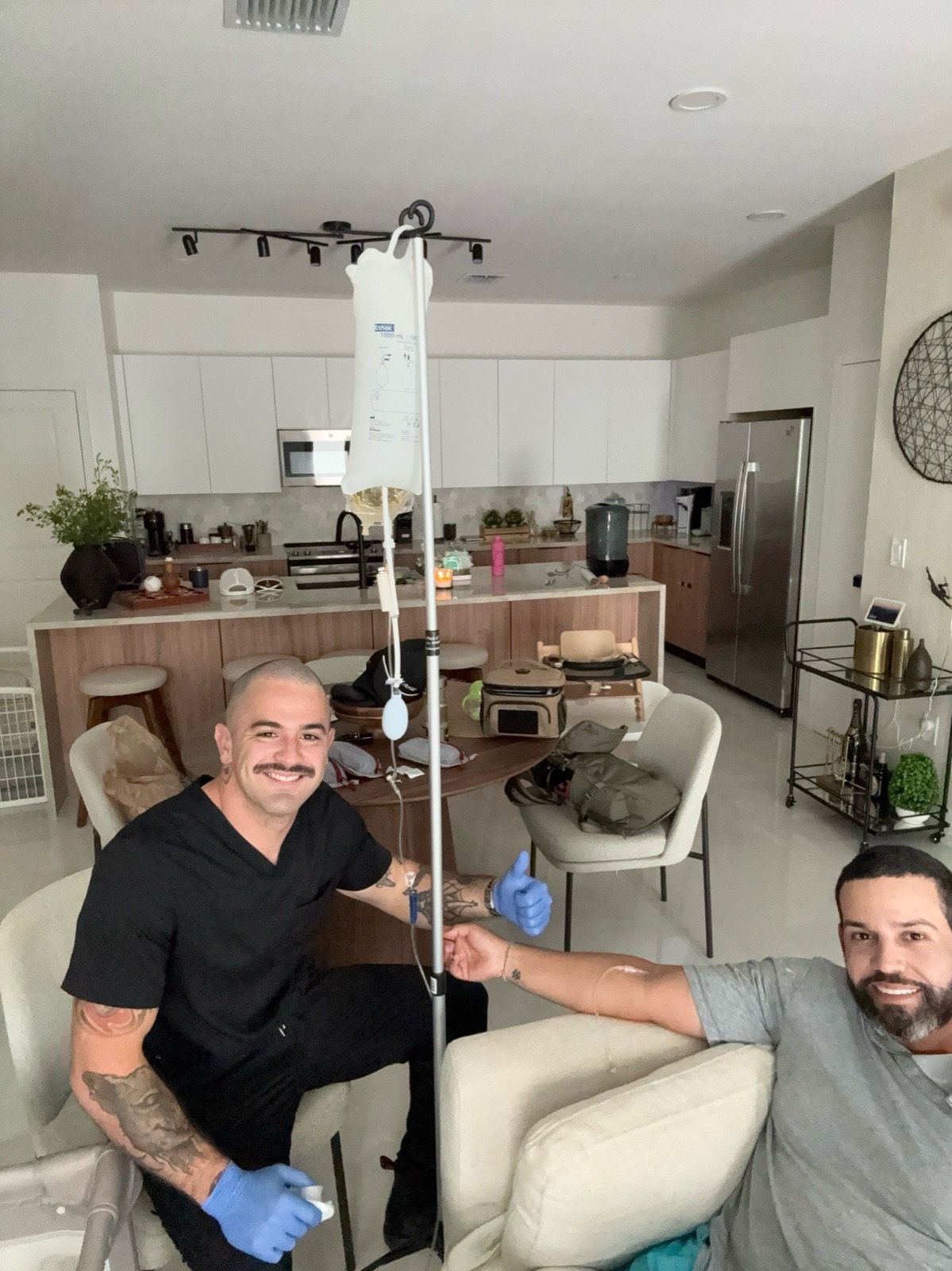 Javier The IV Medic giving a client IV hydration at home in Miami